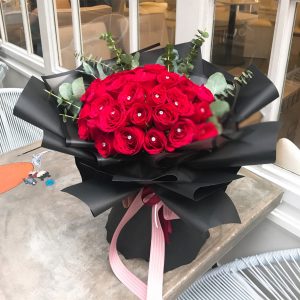 red roses hand bouquet