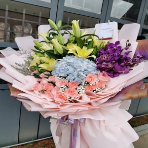 lilly pink roses and orchid bouquet